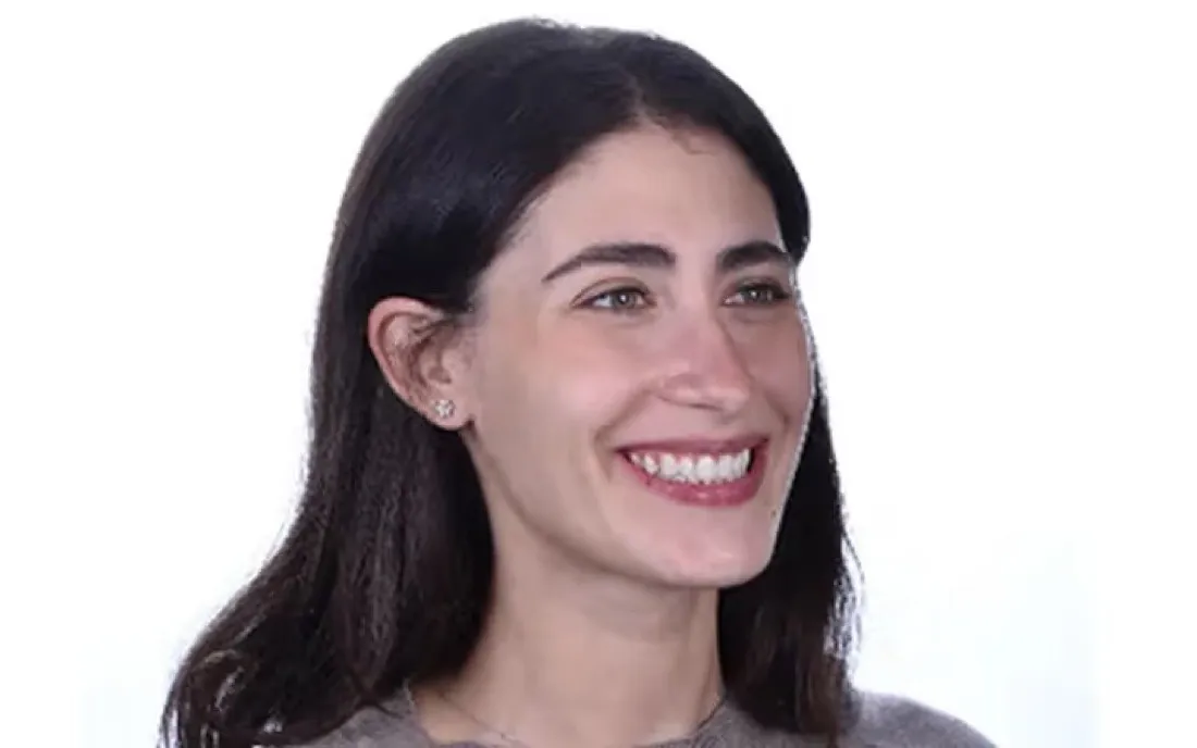 The same patient smiling in three-quarter profile after braces treatment