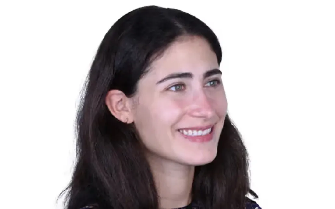 A patient smiling in three-quarter profile before braces treatment
