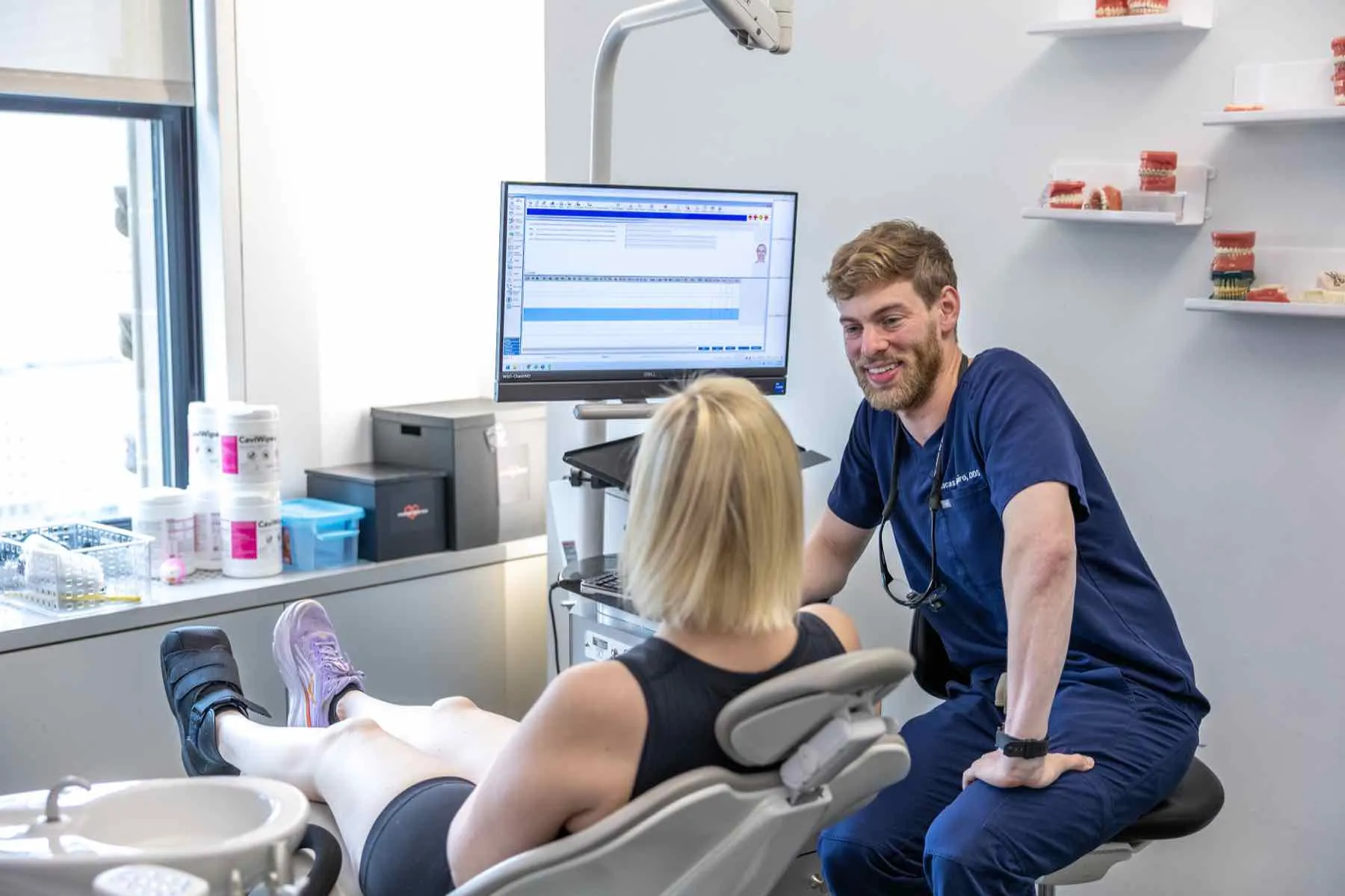 Dr. Lucas W. Shapiro reviewing a treatment plan with a patient