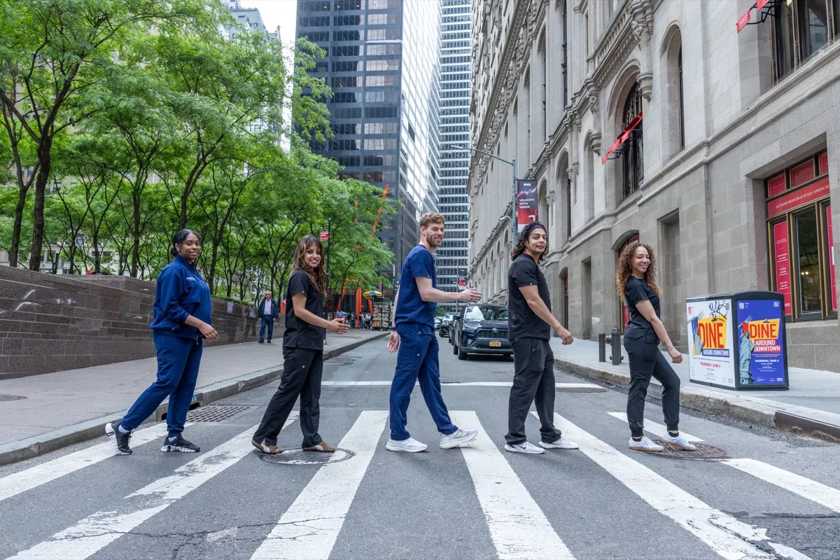 Wall Street Orthodontics team crossing the street in the Financial District
