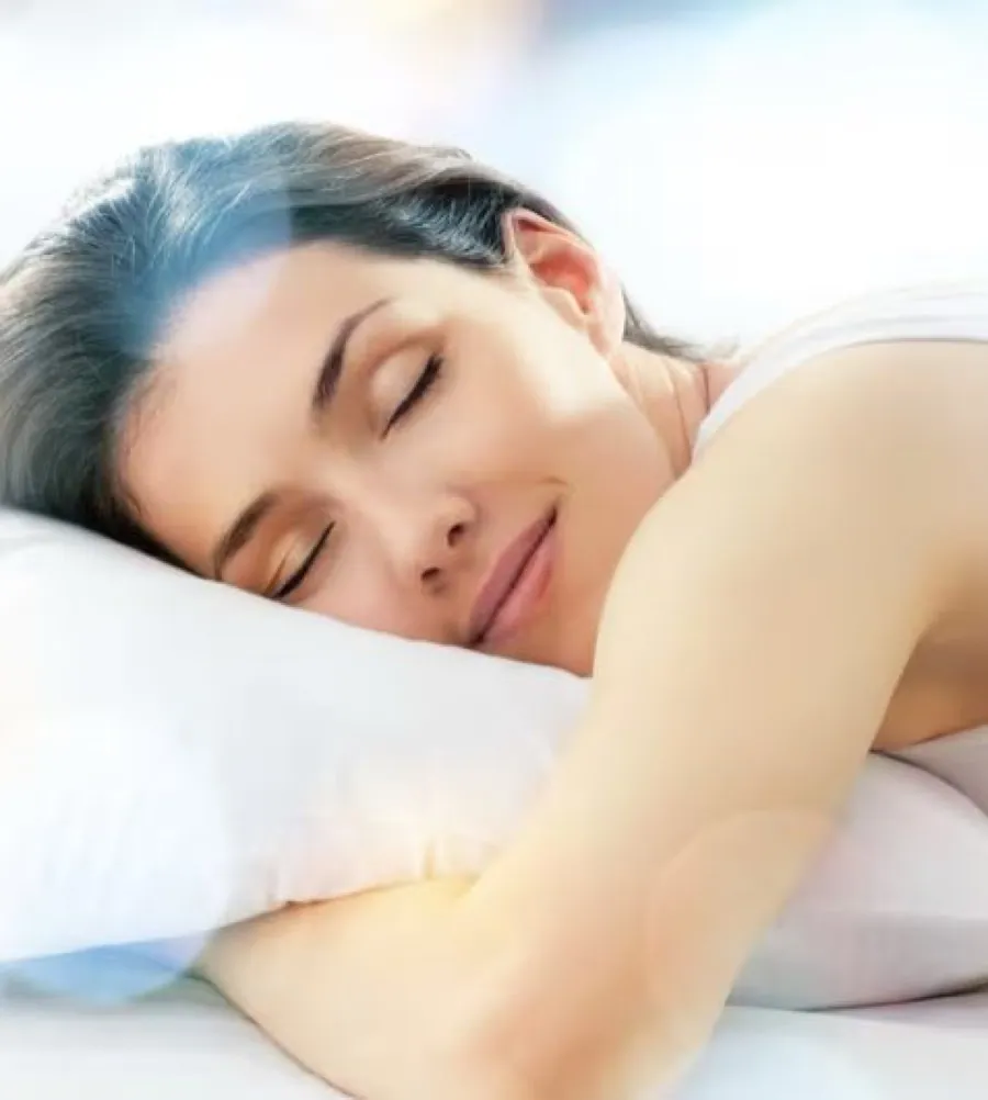 A woman asleep on her side, breathing through her nose